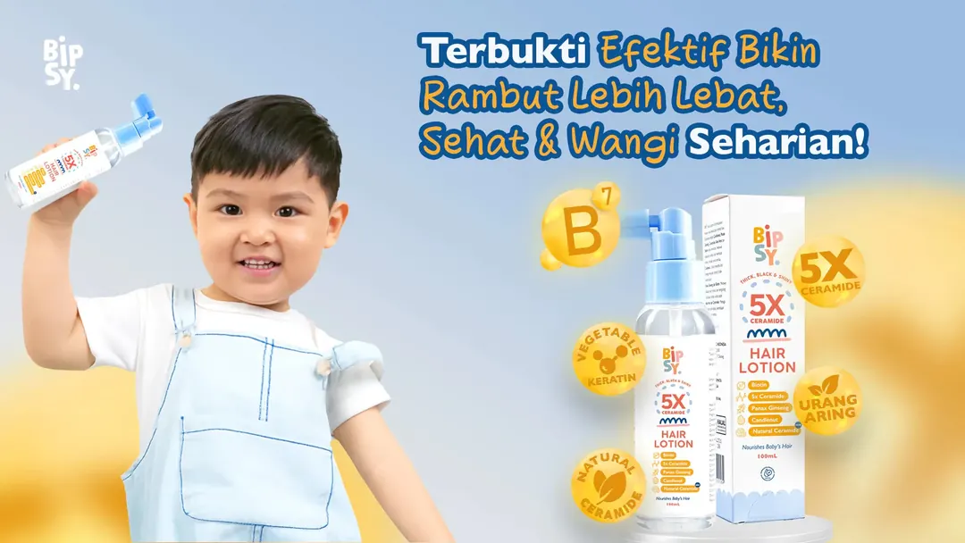 Anak memegang BIPSY Hair Lotion dengan Biotin dan 5x Ceramide